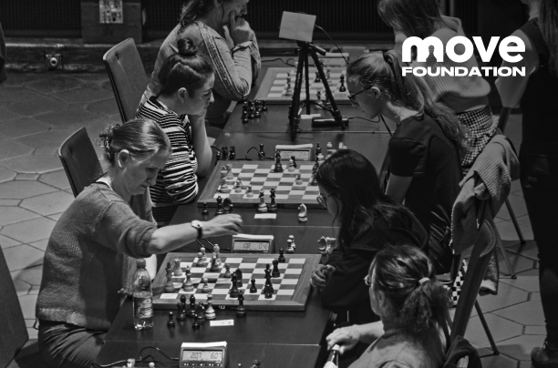 Players at chess tables, with the MOVE Foundation logo